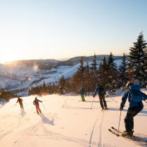 Les Congères Group of friends skiing in the Chic Chocs in Quebec Canada