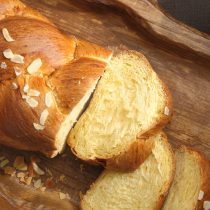 Les Congères Sweet brioche bread on tray with knife and marmalade